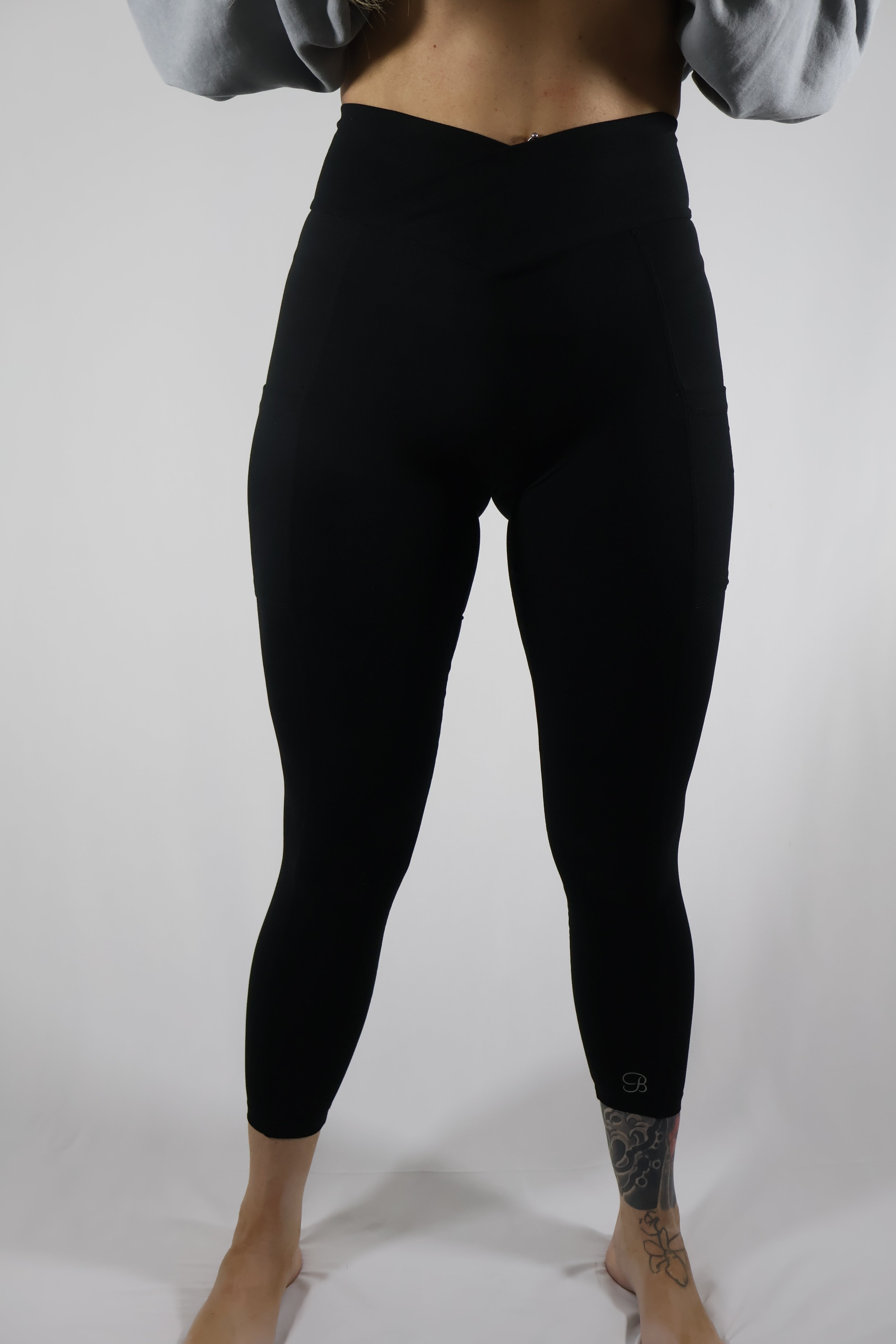 Bombshell Sportswear Crossover Waist Black Leggings / Size XS / L
