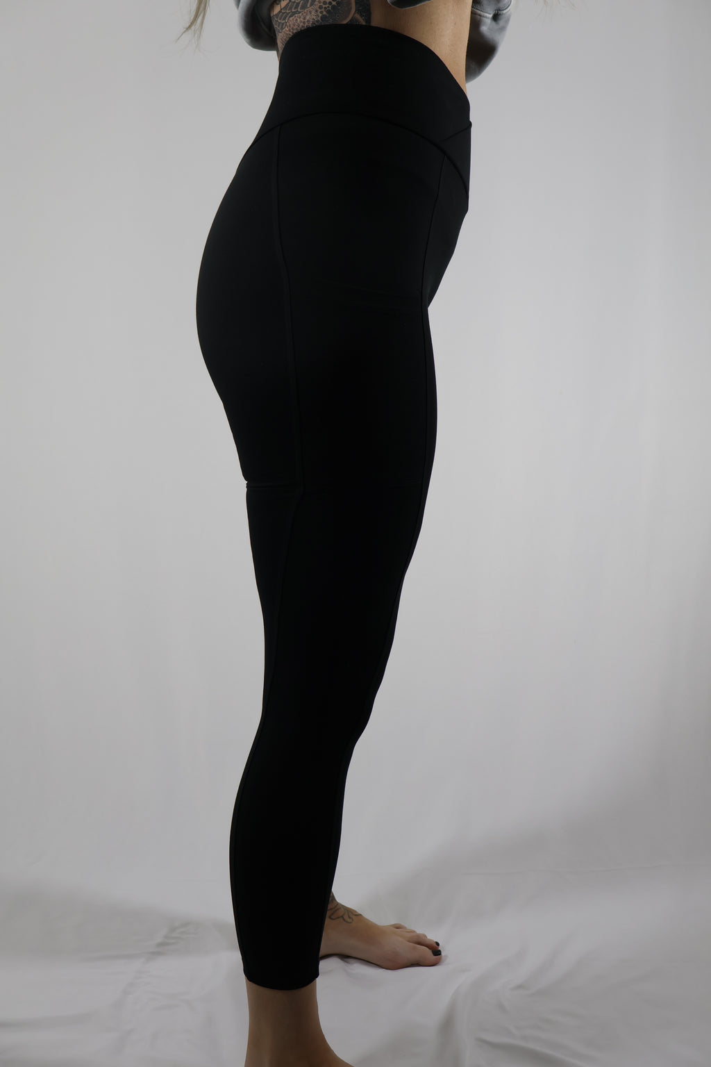 Bombshell Sportswear Crossover Waist Black Leggings / Size XS / L