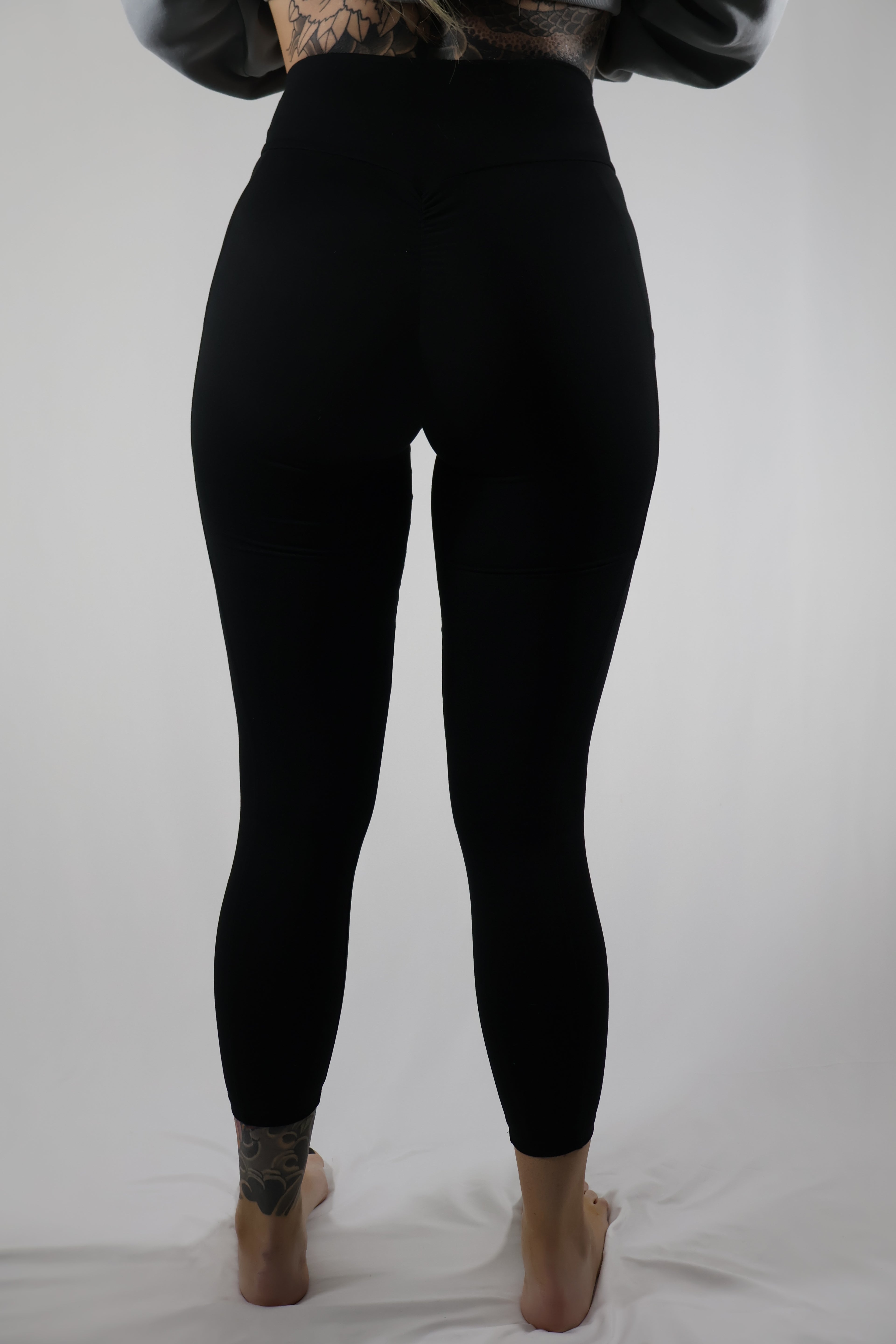Bombshell Sportswear Crossover Waist Black Leggings / Size XS / L